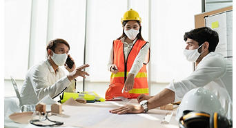 Group construction worker are meeting and brainstorm together at the workplace to discuss for new project during covid19 pandemic, Architect engineer teamwork wearing face mask while discuss together.