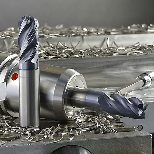 WIDIA WCE4 solid end mill, WCE4 in tool holder, and metal chips on a metal workpiece