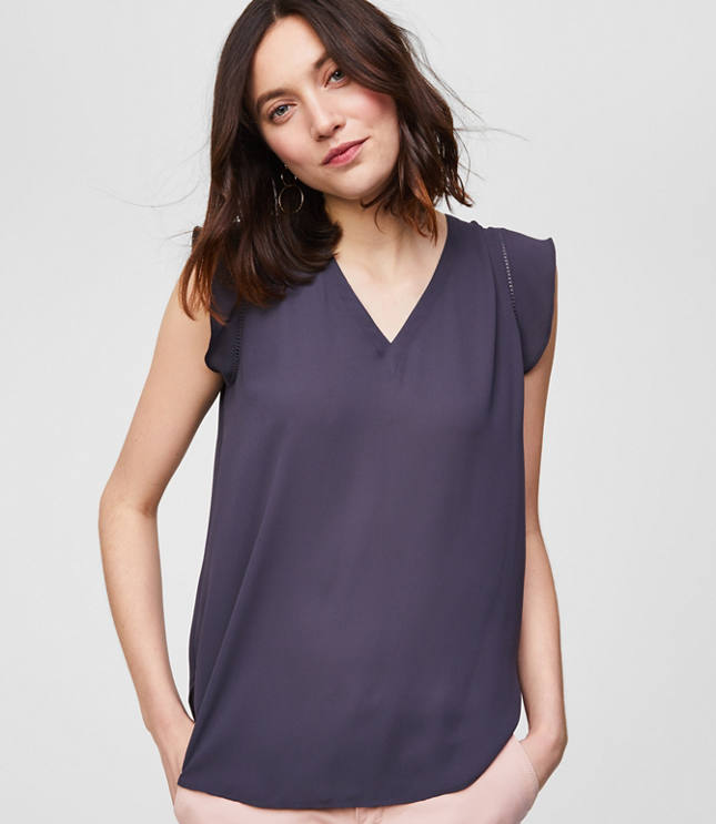 Flutter sleeves are a femme finish for this oh-so-polished and fluid shell. V-neck. Flutter cap sleeves. Shirred beneath back yoke. Shirttail hem.