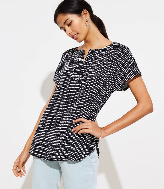 Spliced with a fluid woven front - and soft knit sleeves and back - this tee has just the right amount of modern-cool allure. Split neck with ties. Short dolman sleeves. Hi-lo shirttail hem.