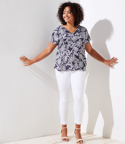 Spliced with a fluid woven front - and soft knit sleeves and back - this tee has just the right amount of modern-cool allure. Split neck with ties. Short dolman sleeves. Hi-lo shirttail hem.