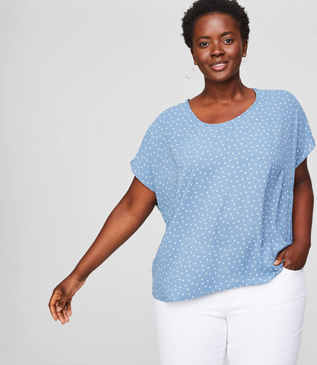 Spliced with a fluid woven front - and soft knit sleeves and back - this tee has just the right amount of modern-cool allure. Round neck. Short dolman sleeves. Hi-lo shirttail hem.