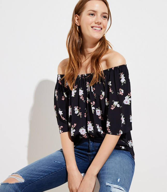 Warm-weather dressing is but a dream with this flowy top, styled with an elasticized neckline you can wear off the shoulder for two looks in one. Flared short sleeves. Side slits.