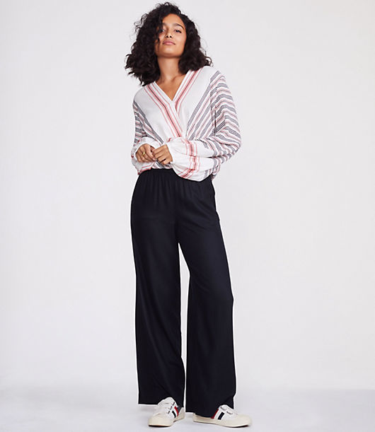 With a wooly handfeel, this extra cozy and drapey pair is a fresh take on a forever favorite wide leg silhouette. Elasticized waist. Slash pockets. 30 1/2inch inseam.