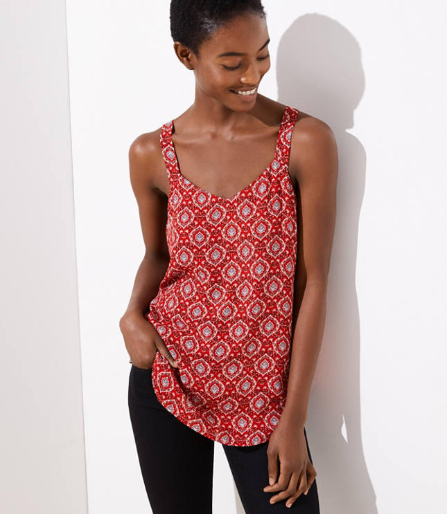 Polished and flattering chic has never been simpler than this fluid cami, styled with a wide V-neck. Sleeveless. Shirttail hem.