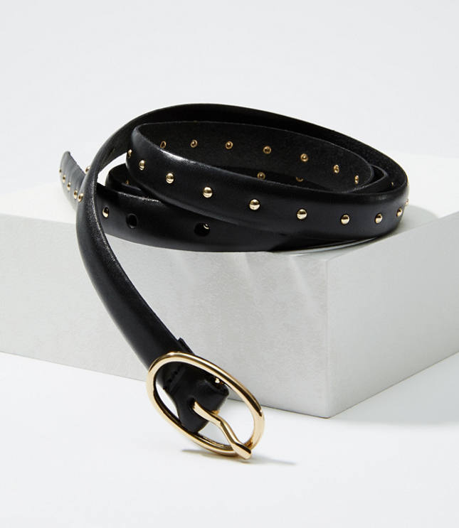 Little studs add a little tough-luxe attitude to this instant outfit transformer. Adjustable buckle front.