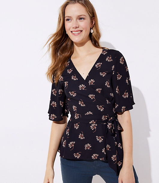 This romantic wrap blouse proves the flattering appeal of a tied waist (with a hint of flair from its hem, too). V-neck. Flutter half sleeves. Waist ties.