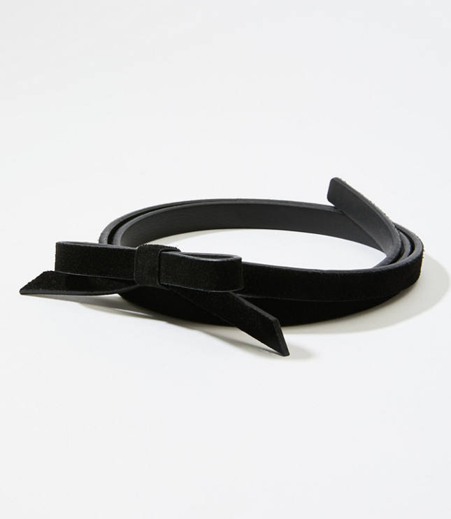 In rich suede, this have-to-have skinny belt wraps up your look - in the most luxe way. Stud closure.