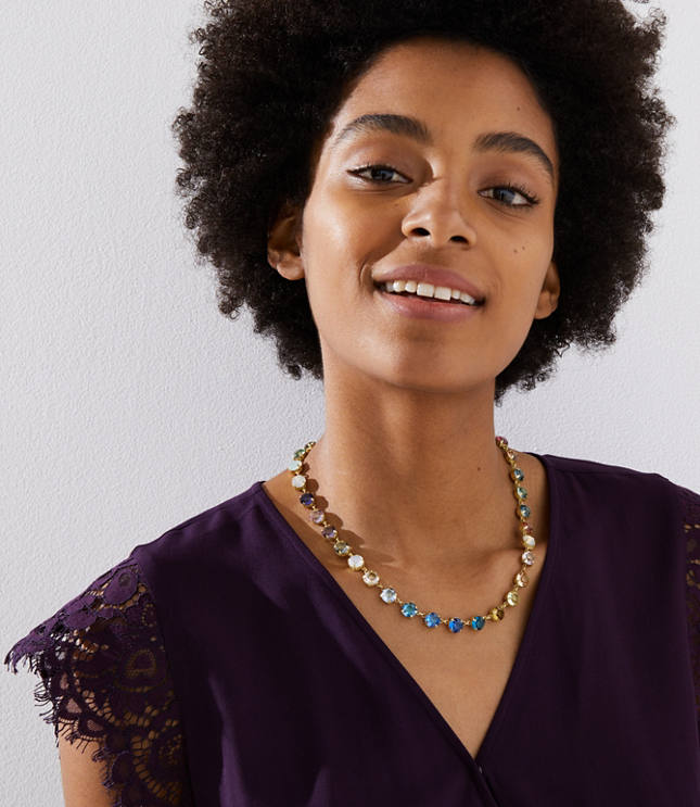 Effortlessly sleek and dazzling, this crystal-studded necklace is the treasure at the end of the rainbow. Goldtone finish.