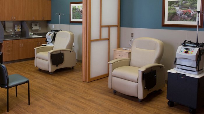 Two beige Champion Chair recliners in a healthcare facility