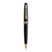 An Expert ballpoint pen with gold trim stood upright with pen tip pointing down. image number 1