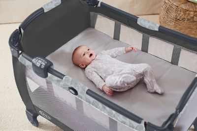 newborn sleeping in pack n play bassinet