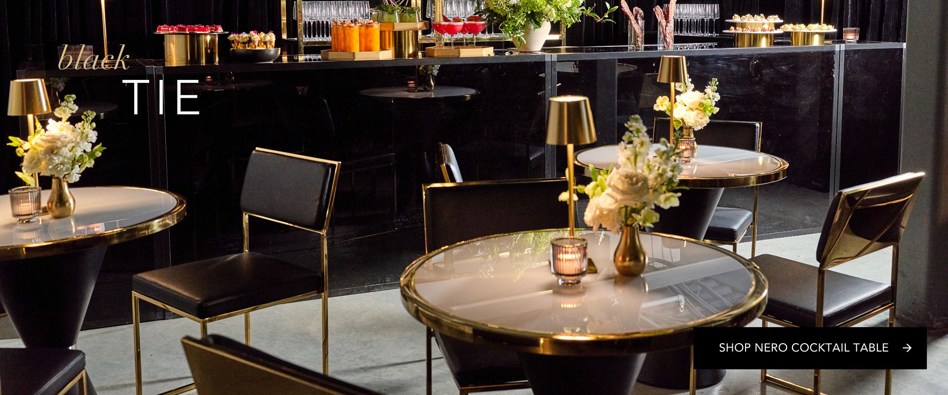 Luxury event cocktail lounge featuring Nero Cocktail Tables for high-end wedding and corporate gala rental