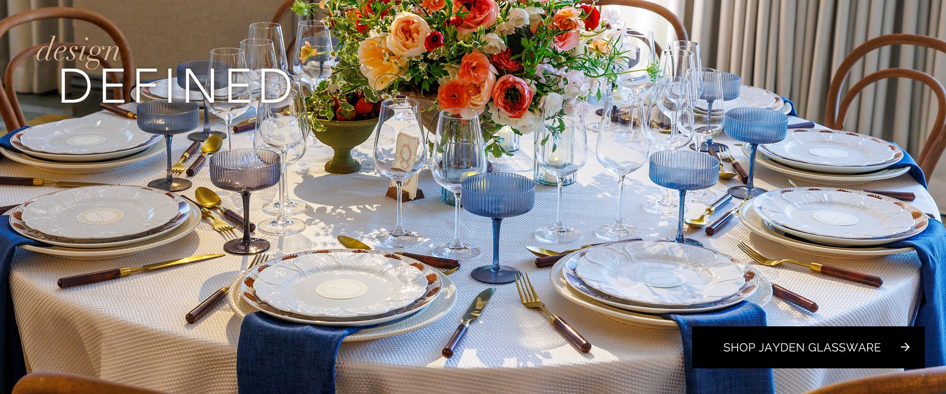 Fine event table setting highlighting the Jayden Grey glassware collection with modern ribbed blue-grey coupes and wine glasses alongside luxury tableware.