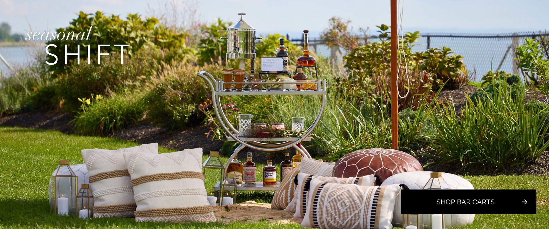 Party Rental Ltd. Fall Bar Cart set on a blanket with pillows outdoors