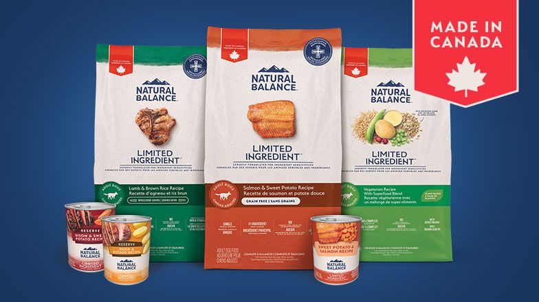 three cans and three bags of natural balance limited ingredient dog food with made in canada call out