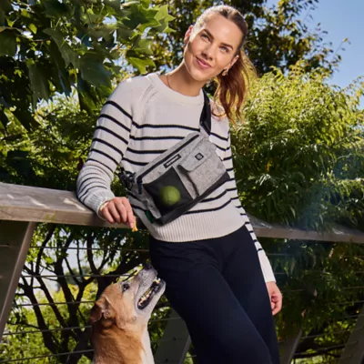 Cleverpup Dog Walk & Train Sling Bag W/ Poop Bag Dispenser, Treat Pocket, and Hidden Squeaker - Image 3