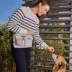 Cleverpup Dog Walk & Train Sling Bag W/ Poop Bag Dispenser, Treat Pocket, and Hidden Squeaker image thumbnail 3