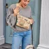 Cleverpup Dog Walk & Train Sling Bag W/ Poop Bag Dispenser, Treat Pocket, and Hidden Squeaker image thumbnail 2