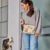 Cleverpup Dog Walk & Train Sling Bag W/ Poop Bag Dispenser, Treat Pocket, and Hidden Squeaker image thumbnail 3