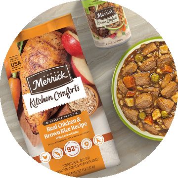 Bag of Merrick Kitchen Comforts real chicken & brown rice recipe dog food next to a wet dog food can