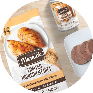 Bag of Merrick Limited Ingredient dog food next to a wet dog food can
