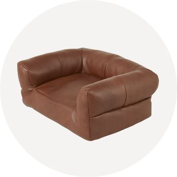 Brown, leathery small pet couch