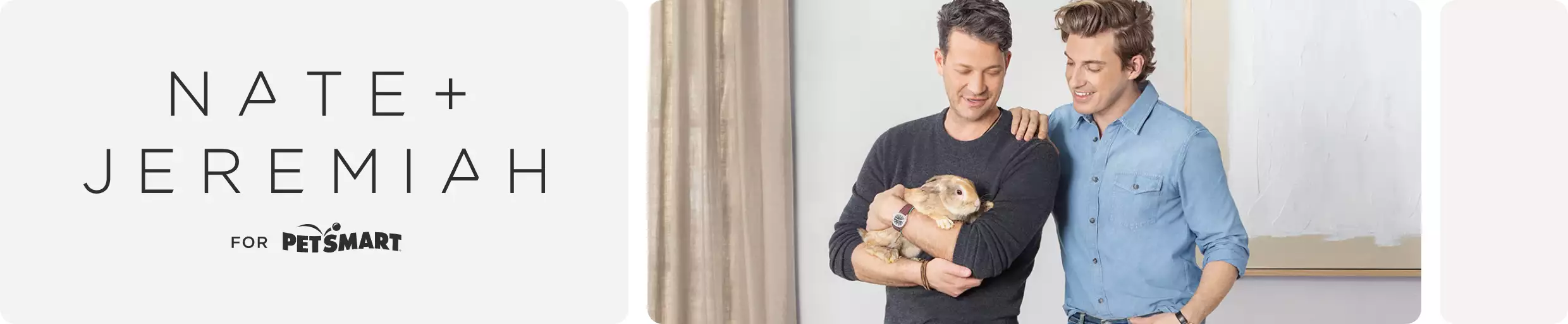 Nate and Jeremiah standing holding a bunny
