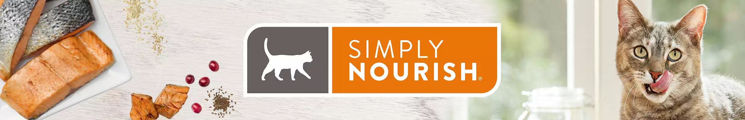 Cat with cranberries, cooked salmon and Simply Nourish logo