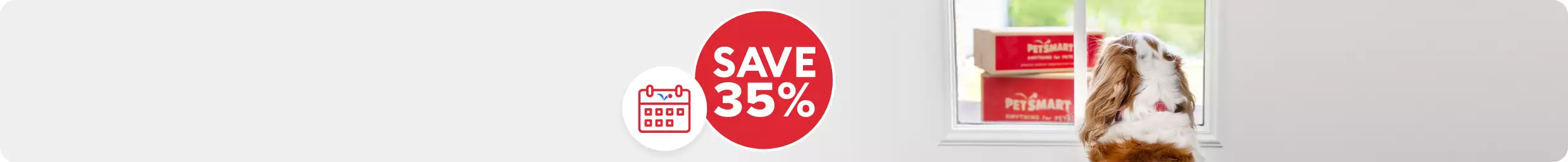 Dog looking out window to see PetSmart boxes, Save 35% text in bubble with calendar illustration