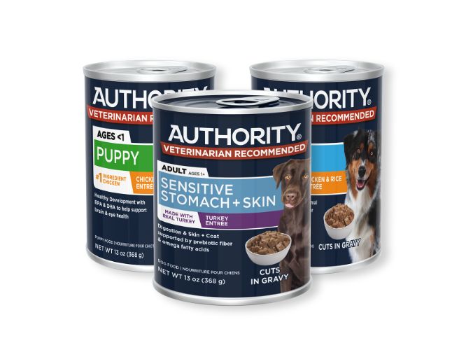 Three cans of Authority dog food