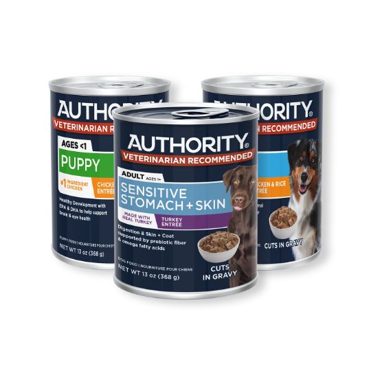 Three cans of Authority dog food