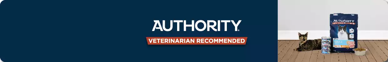 A cat next to Authority cat food, on a dark navy banner with the Authority logo & "Veterinarian recommended"