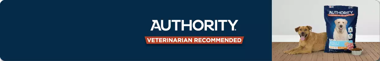 A dog next to Authority dog food, on a dark navy banner with the Authority logo & "Veterinarian recommended"