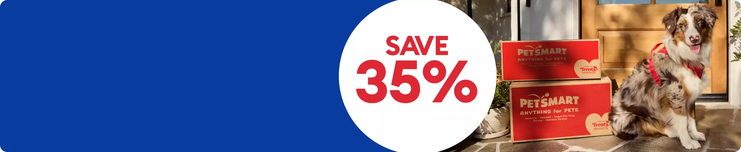 Save 35% callout and a dog standing by two PetSmart shipping boxes