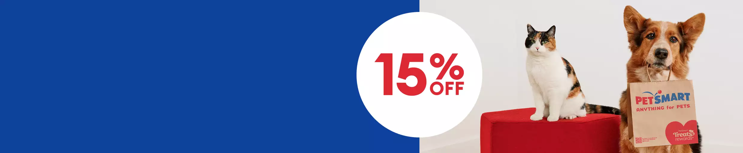 A cat and a dog with a PetSmart bag pose together with a badge that says 15% off		