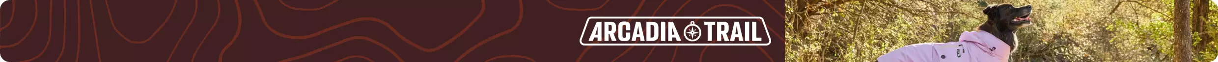 Arcadia Trail logo & dog outside who's wearing a pink jacket
