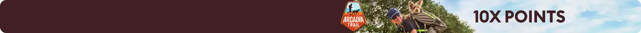 10X points callout, Arcadia Trail logo & a woman carrying a dog in a travel backpack