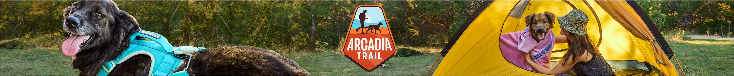 Dog wrapped in a towel inside a tent with a woman at a wooded campsite, Arcadia Trail logo displayed