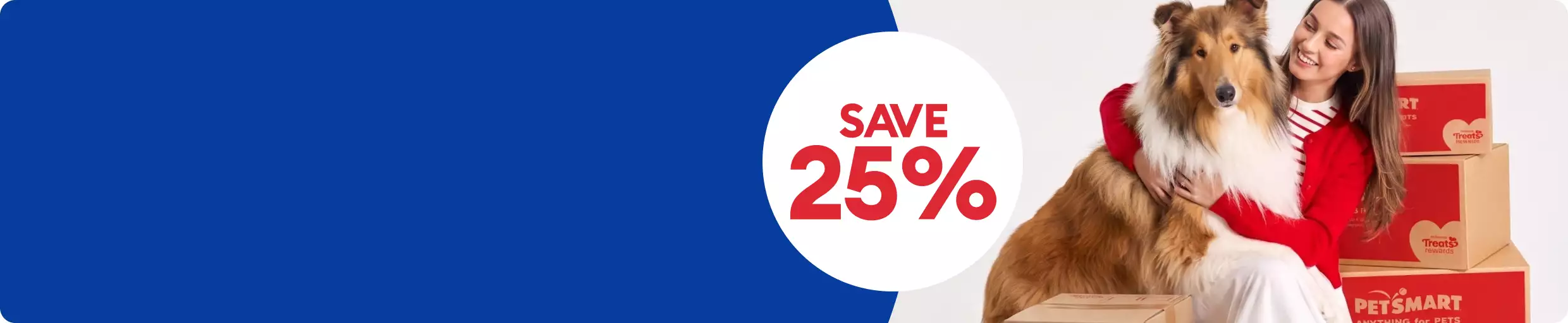 Woman in red sweater holding a gray cat beside stacked PetSmart shipping boxes with a 25% OFF callout