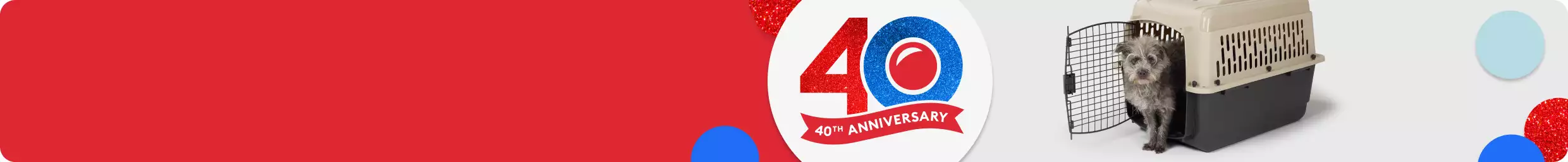 40th Anniversary graphic and a dog standing in an open plastic carrier