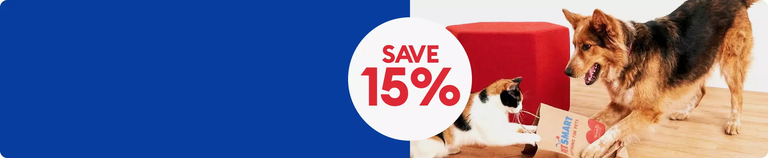 SAVE 15% with cat & dog in living room playing in open PetSmart bag