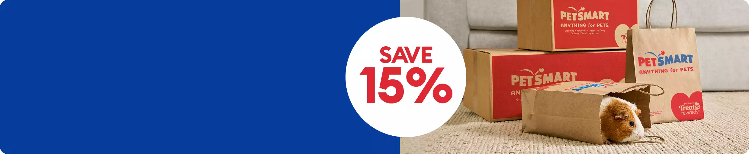 Guinea pig inside shopping bag by PetSmart shipping boxes & a save 15% callout