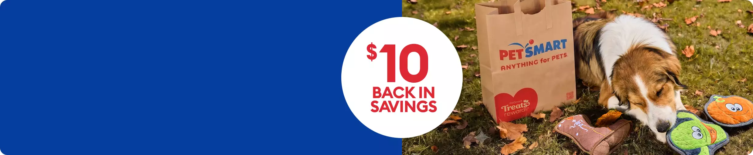$10 back in savings shown with PetSmart bag and tan & white dog with toys
