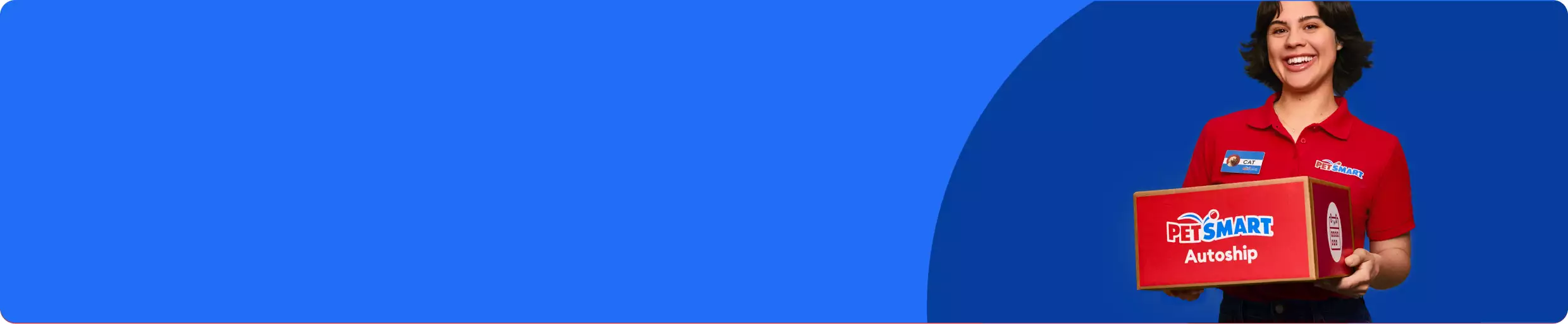 PetSmart Associate wearing red shirt with red PetSmart Autoship box in hands