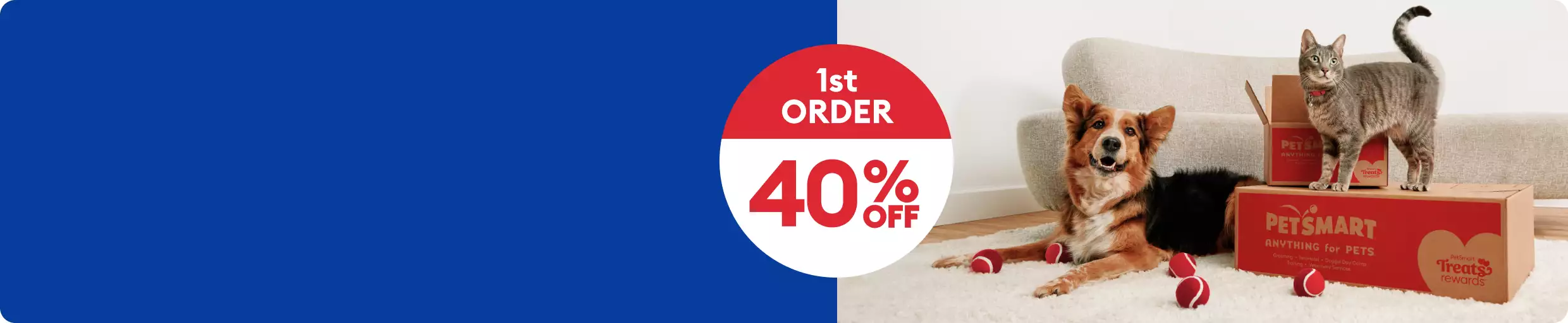 Dog & cat with PetSmart shipping boxes & toys and the callout, 40% off 1st order