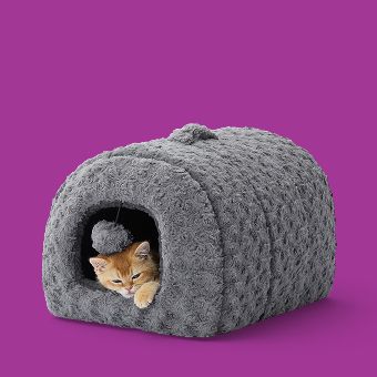 Cat lying in a Whisker City Fur Hideaway Bed