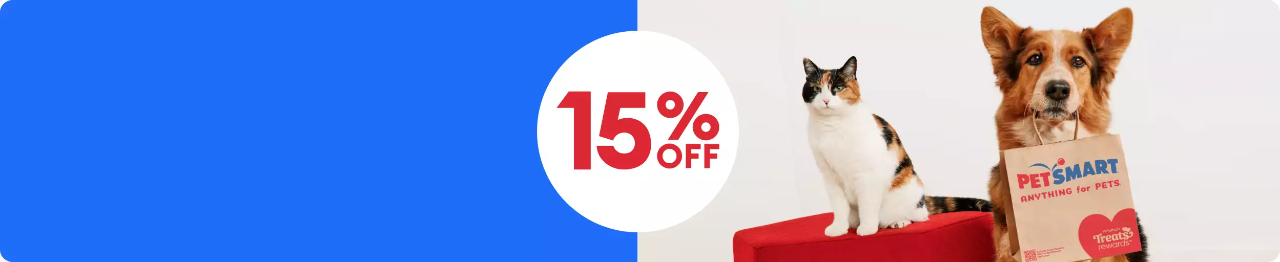 15% off callout & a cat sitting next to a dog who's holding a PetSmart bag