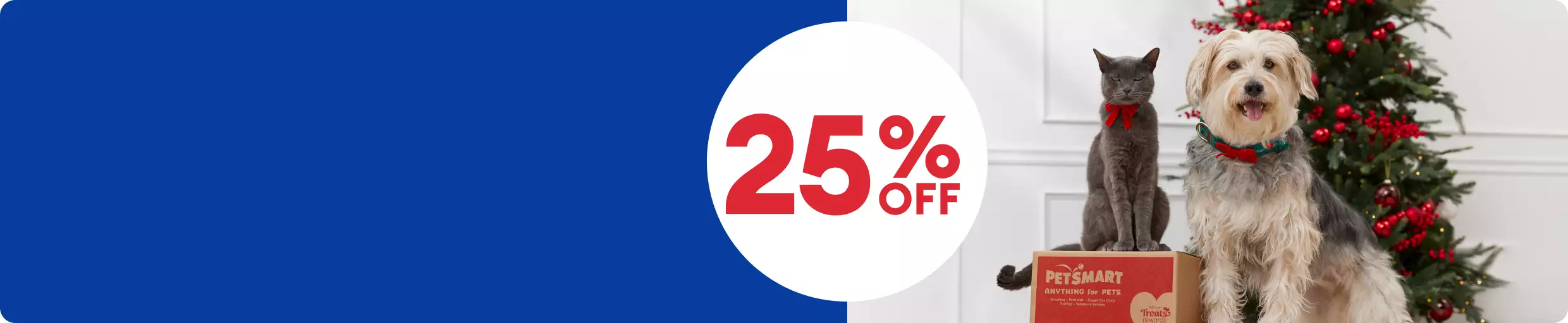 25% off callout & a cat sitting on a PetSmart box next to a dog and a Christmas tree