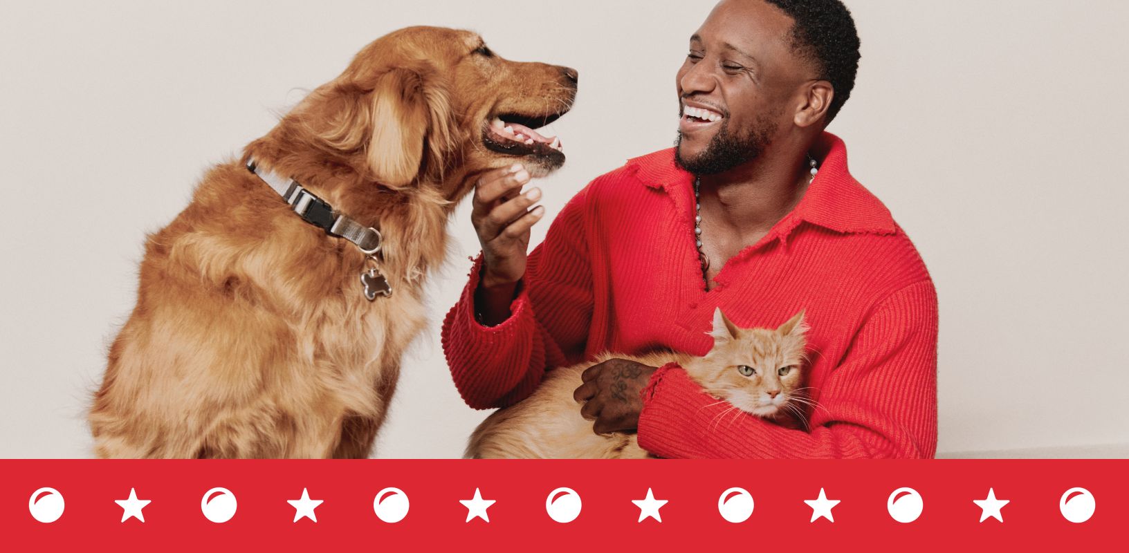 Man sitting with a dog & a cat